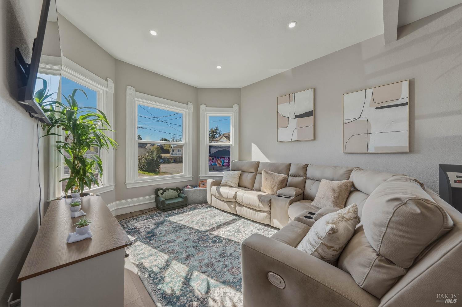 107 Sebastopol Avenue Santa Rosa, CA 95407 - Photo 6 of 33 a living room with furniture and a large window
