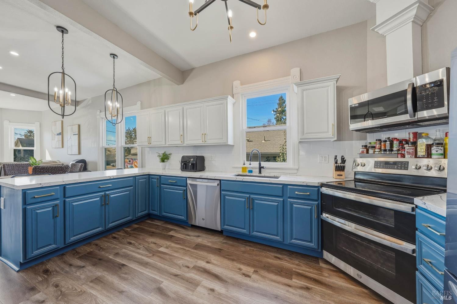 107 Sebastopol Avenue Santa Rosa, CA 95407 - Photo 10 of 33 a large kitchen with stainless steel appliances granite countertop a stove and cabinets