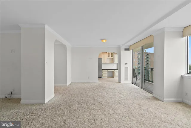 a view of empty room with floor to ceiling window