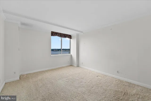 a view of a swimming pool and an outdoor seating