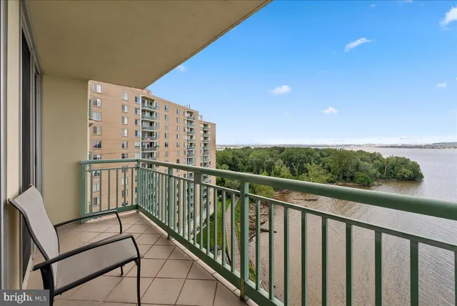 a view of a balcony with chairs