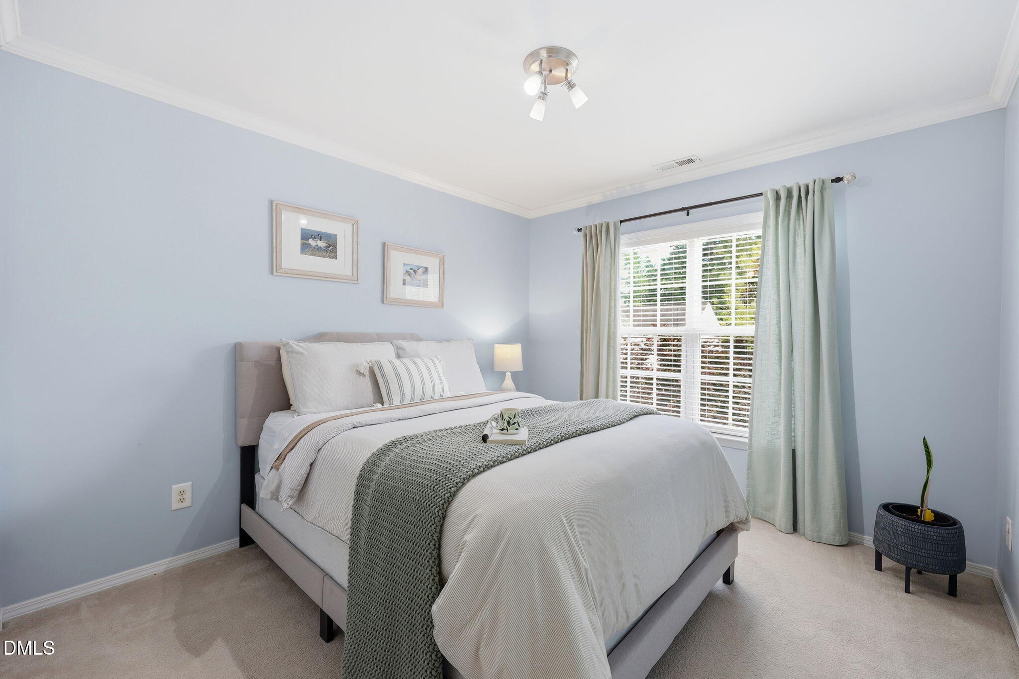 5629 Enoree Lane Raleigh, NC 27616 - Photo 25 of 38 a bedroom with a bed and a window