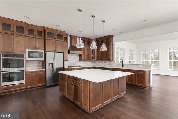 an empty room with wooden floor