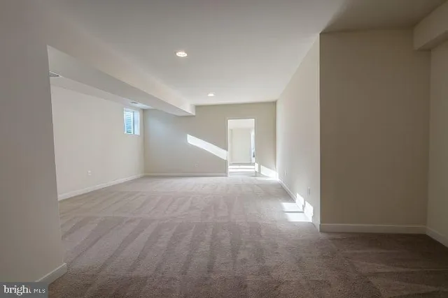 a view of a livingroom with a dishwasher and wooden floor