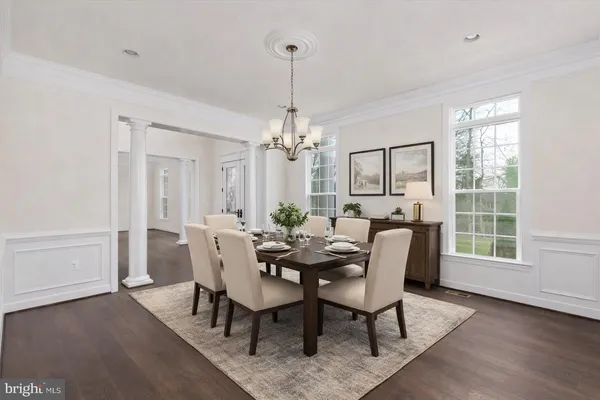 a living room with furniture a window and piano table