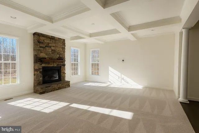 a view of empty room with a fireplace