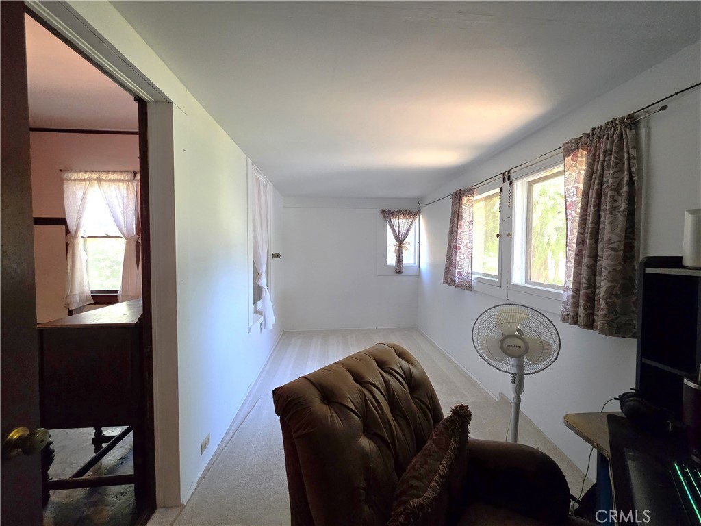 1414 Marin Street Corning, CA 96021 - Photo 12 of 43 a room with furniture and a window