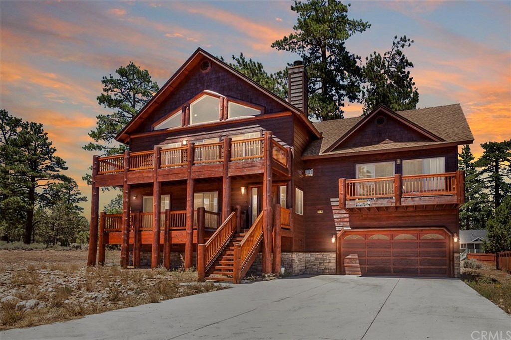 a front view of a house with a garage
