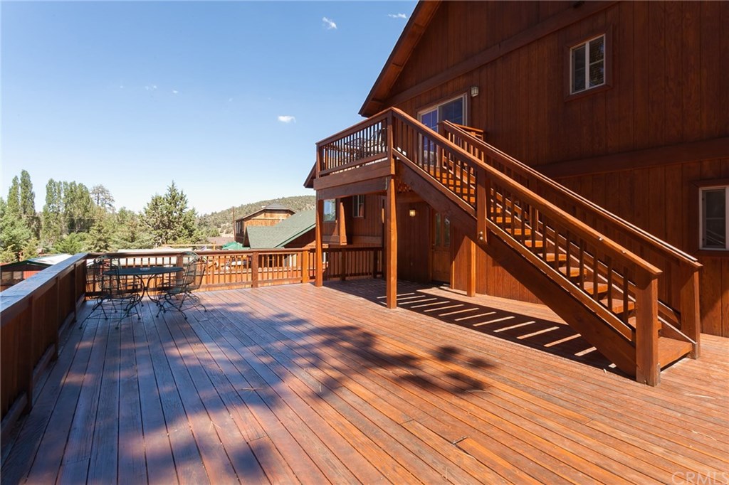 209 Rodeo Road Big Bear City, CA 92314 - Photo 30 of 39 a view of a roof deck with wooden floor and fence