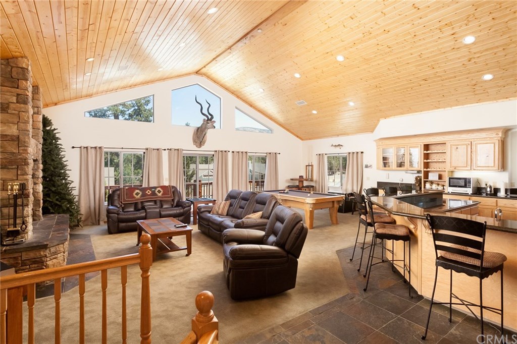 209 Rodeo Road Big Bear City, CA 92314 - Photo 3 of 39 a living room with furniture and a table
