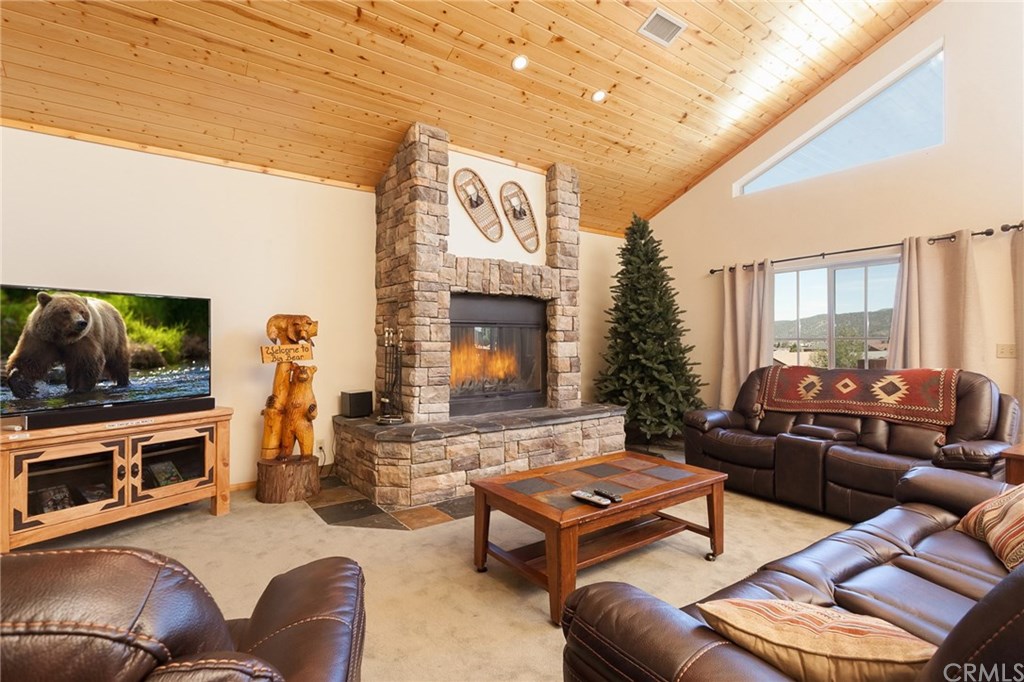 209 Rodeo Road Big Bear City, CA 92314 - Photo 5 of 39 a living room with furniture and a flat screen tv