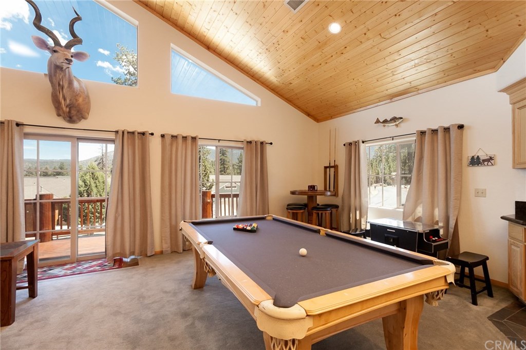 209 Rodeo Road Big Bear City, CA 92314 - Photo 6 of 39 a room with pool table and windows