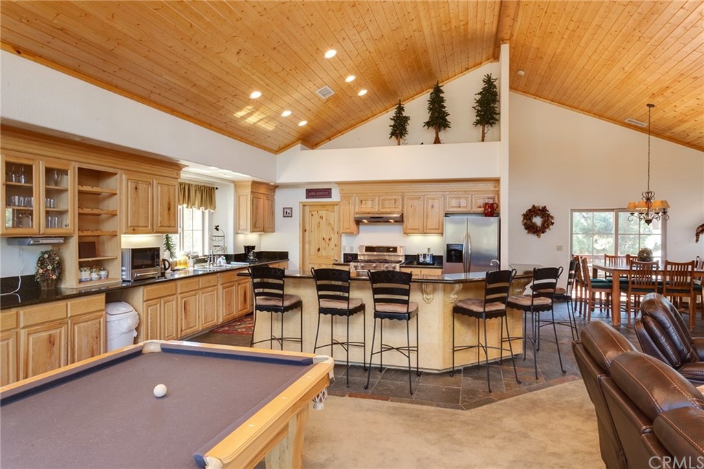 209 Rodeo Road Big Bear City, CA 92314 - Photo 10 of 39 a kitchen with lots of counter top space and stainless steel appliances