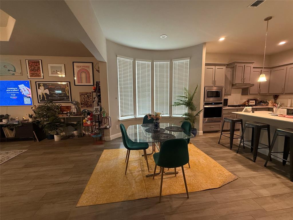 1121 Knightsbridge Road Argyle, TX 76226 - Photo 3 of 7 Dining area with dark wood-style flooring and recessed lighting