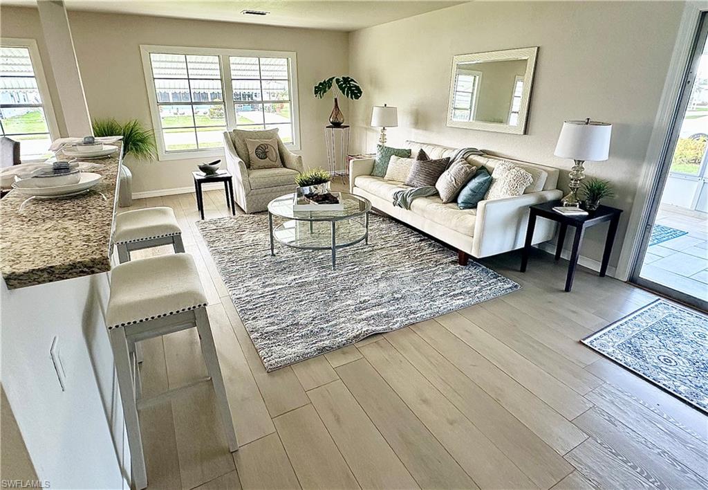 26261 Colony Road Bonita Springs, FL 34135 - Photo 20 of 31 Living room featuring light hardwood / wood-style flooring