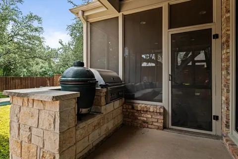 a view of a building with sitting area and furniture