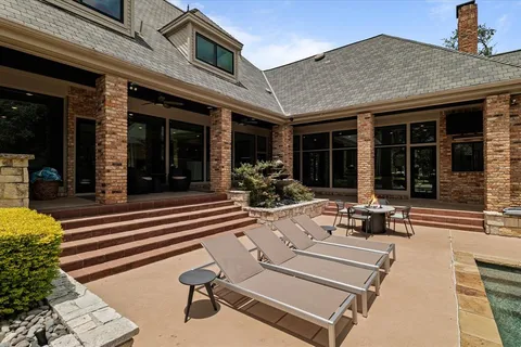 a spacious bedroom with two beds and a desk