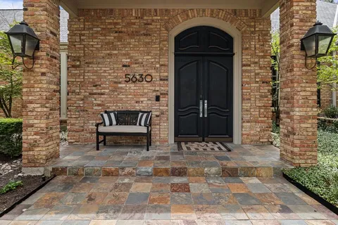 a view of front door of a house with stairs
