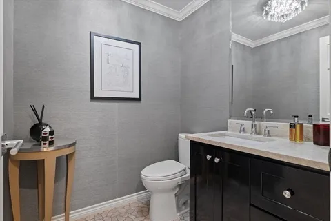 a living room with furniture a table tennis table and a flat screen tv