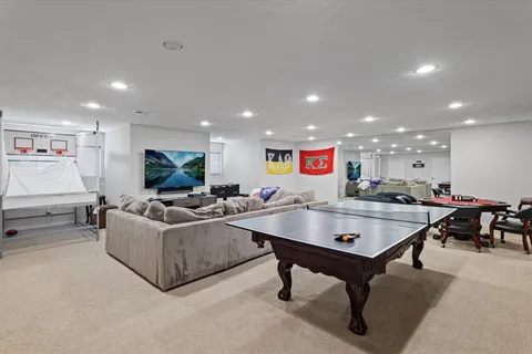 a view of a patio with chairs and potted plants