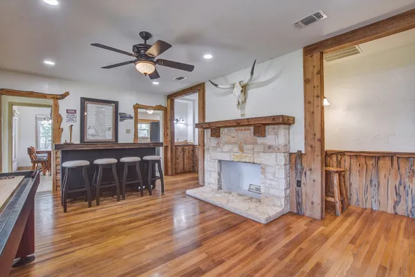 a view of a livingroom with furniture and a fireplace