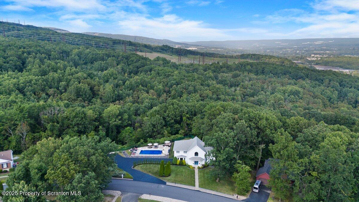 28 Ridgeview Drive Scranton, PA 18504 - Photo 12 of 55 a view of a city with lush green forest