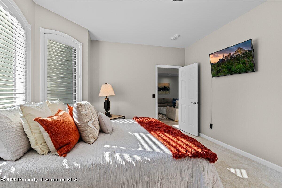 28 Ridgeview Drive Scranton, PA 18504 - Photo 22 of 55 a bedroom with a bed and a flat screen tv