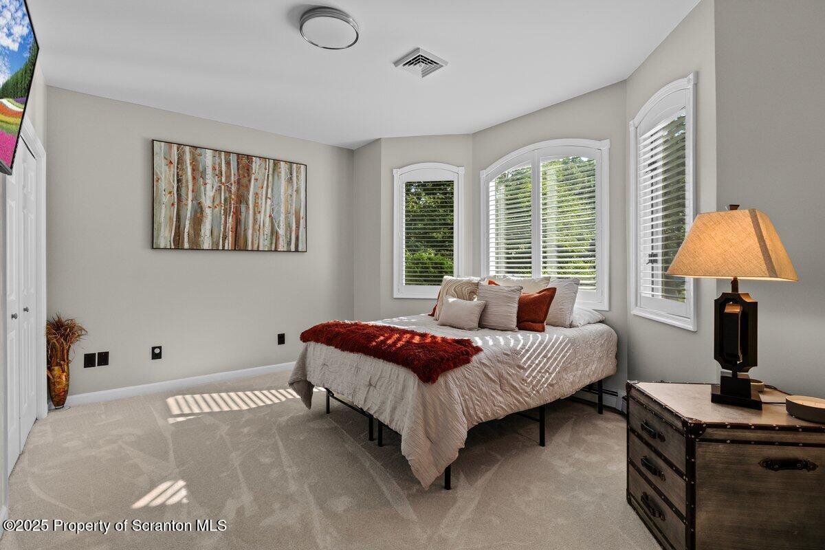 28 Ridgeview Drive Scranton, PA 18504 - Photo 23 of 55 a living room with a bed furniture and a window