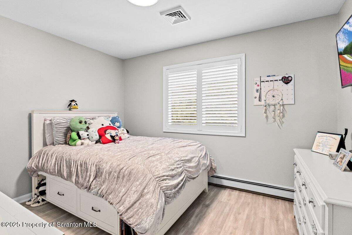 28 Ridgeview Drive Scranton, PA 18504 - Photo 33 of 55 a bedroom with a bed and a window
