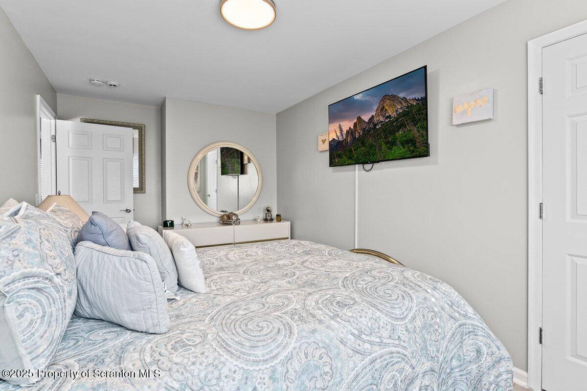 28 Ridgeview Drive Scranton, PA 18504 - Photo 36 of 55 a bedroom with a bed and a flat screen tv