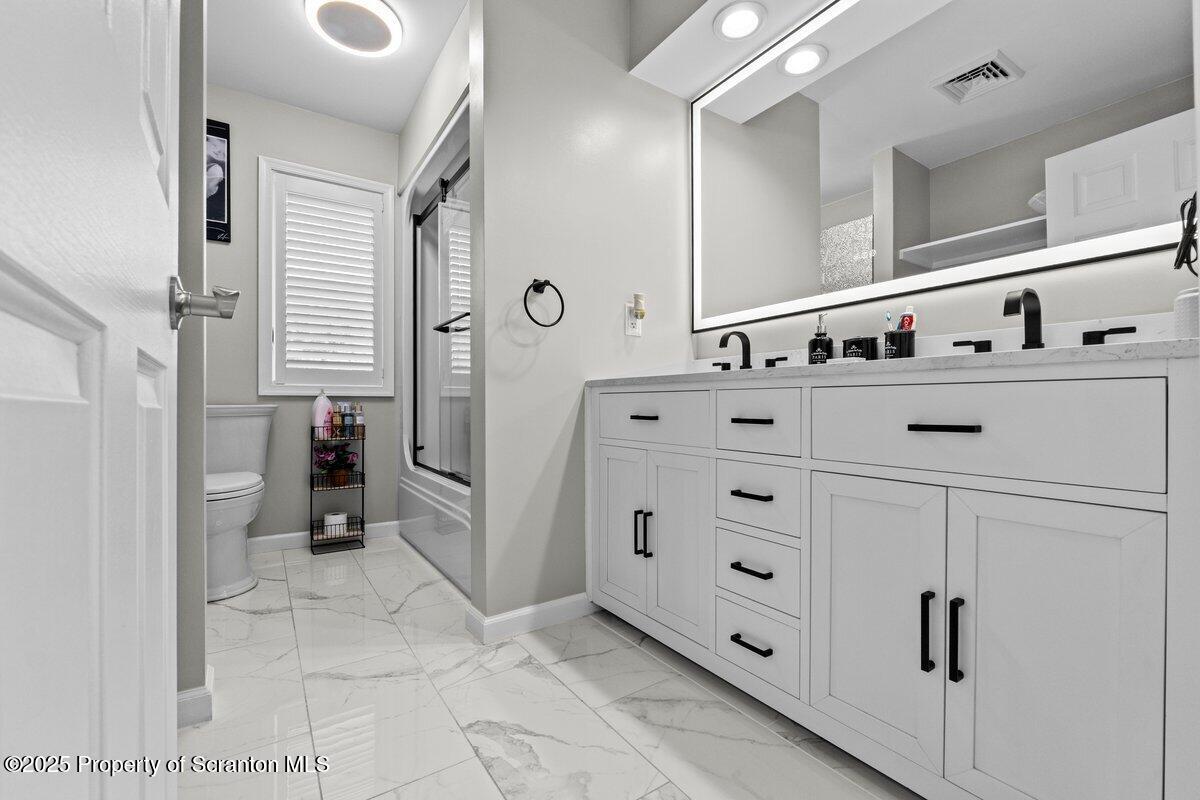 28 Ridgeview Drive Scranton, PA 18504 - Photo 41 of 55 a kitchen with stainless steel appliances cabinets and a window