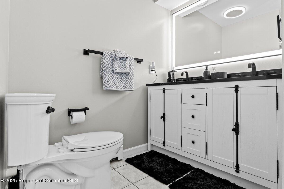 28 Ridgeview Drive Scranton, PA 18504 - Photo 43 of 55 a bathroom with a sink a toilet and a mirror