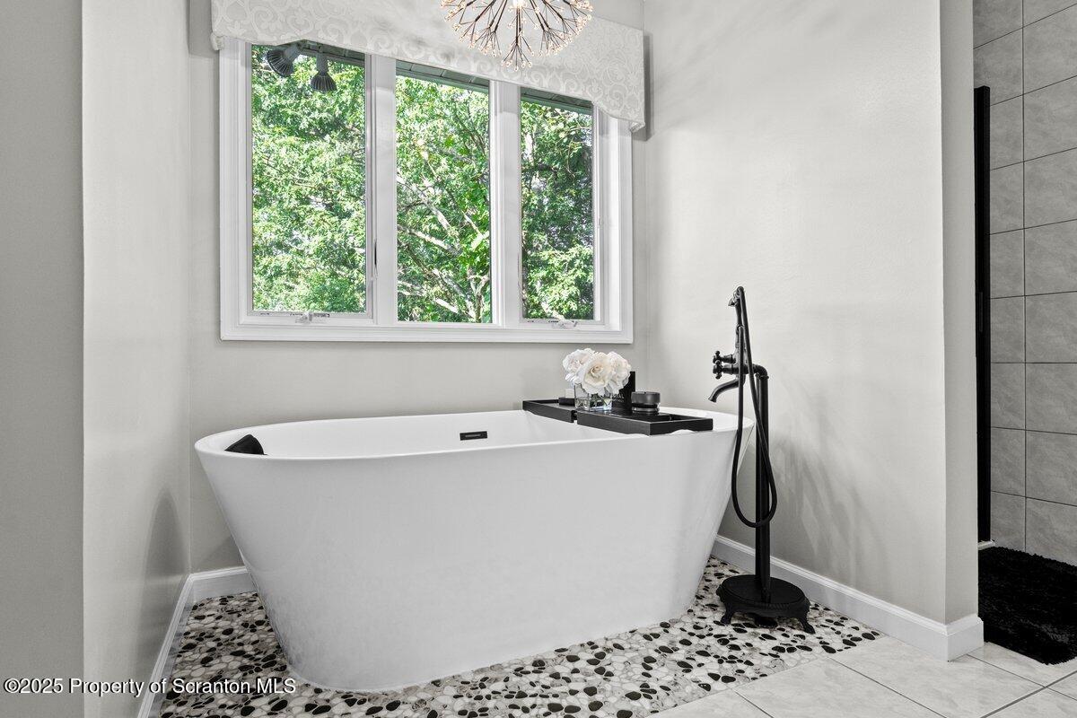 28 Ridgeview Drive Scranton, PA 18504 - Photo 44 of 55 a white bath tub sitting in a bathroom