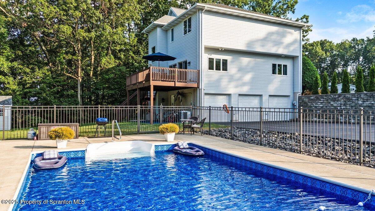 28 Ridgeview Drive Scranton, PA 18504 - Photo 6 of 55 a view of a house with a swimming pool