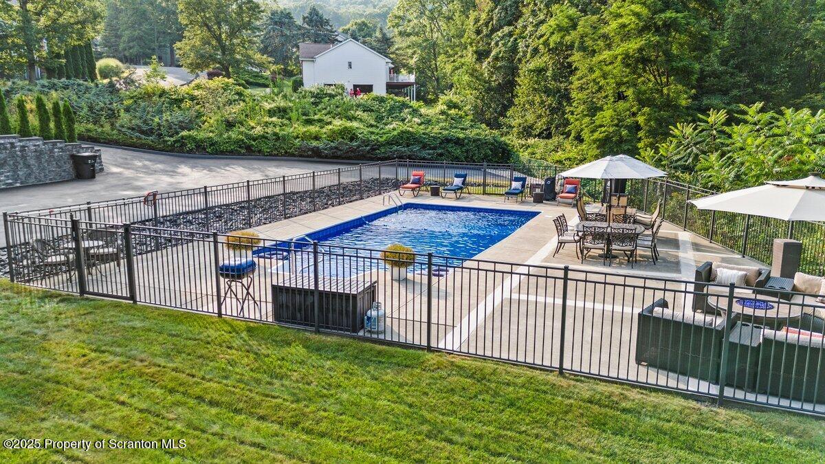28 Ridgeview Drive Scranton, PA 18504 - Photo 8 of 55 a view of a roof deck with chair and wooden fence