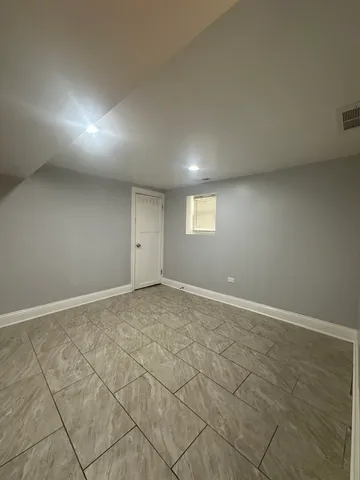 an empty room with a empty space and windows