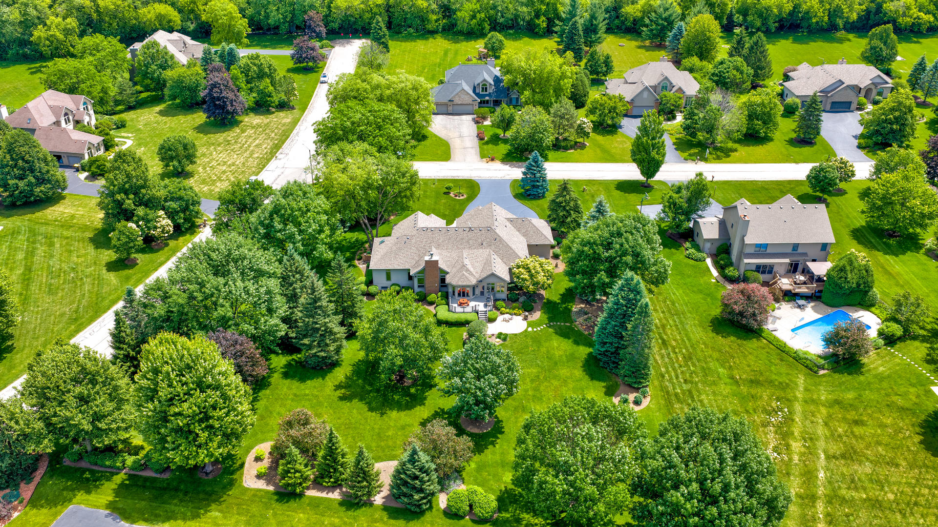 10907 Red Hawk Lane Spring Grove, IL 60071 - Photo 40 of 44 a aerial view of a house with a yard and swimming pool