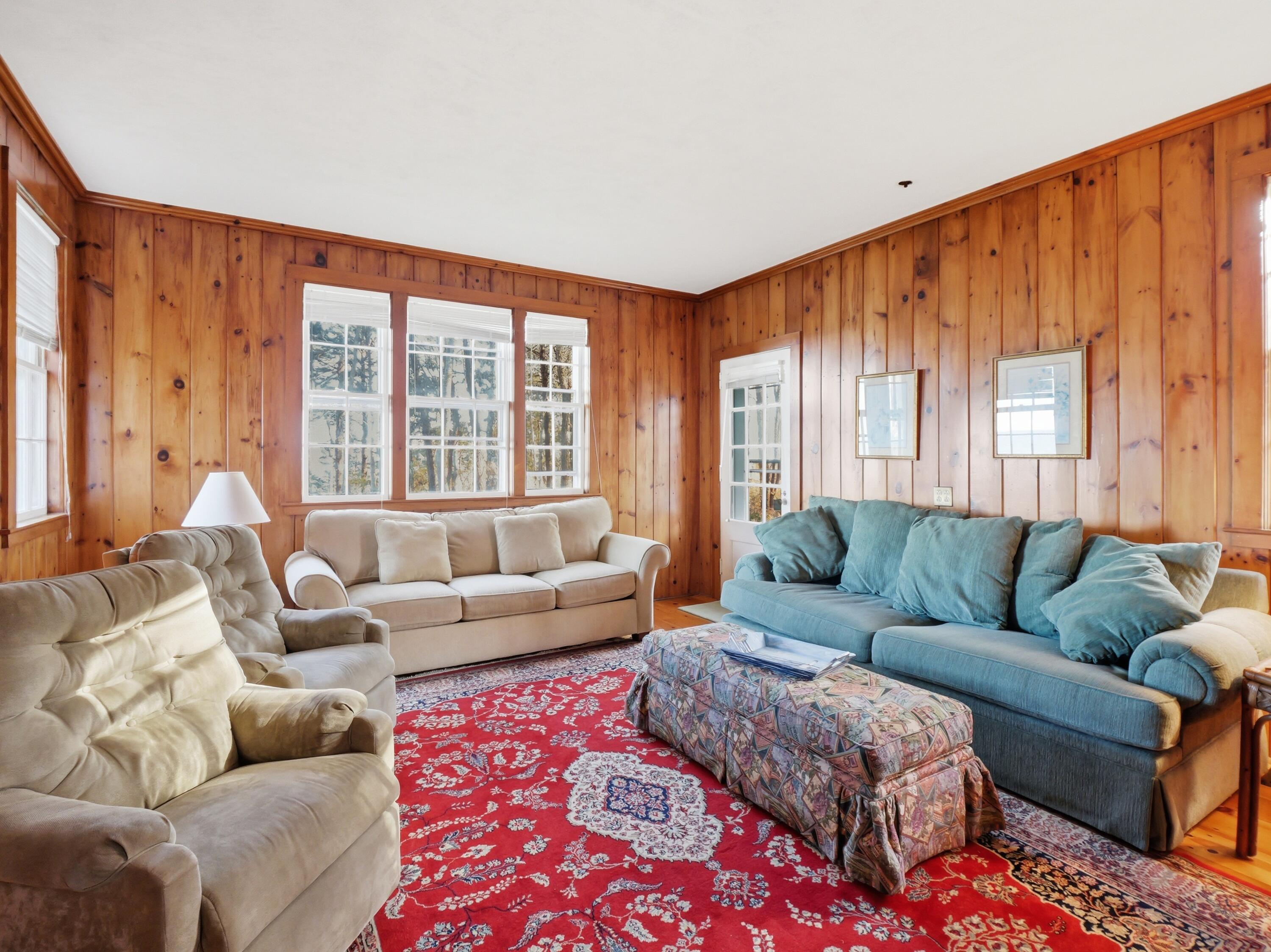 190 Vineyard Road Cotuit, MA 02635 - Photo 22 of 41 a living room with furniture and a large window