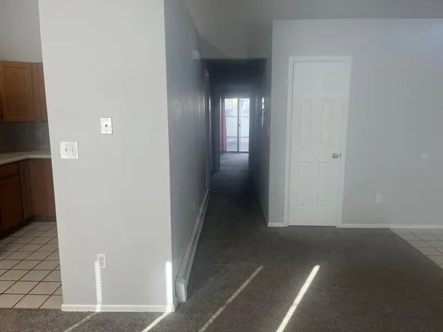 a kitchen with metallic refrigerator freezer and a dishwasher