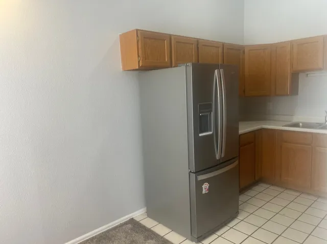 a kitchen with a sink and a stove top oven