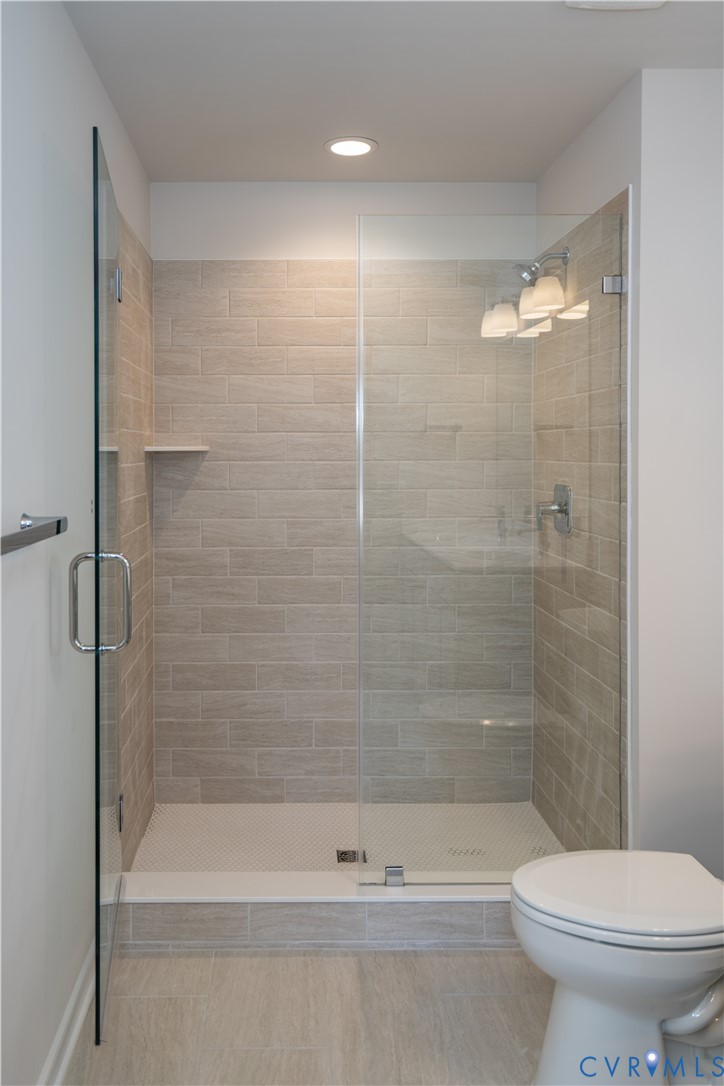 11219 Sparwood Road Chester, VA 23831 - Photo 15 of 28 a bathroom with a shower and a toilet