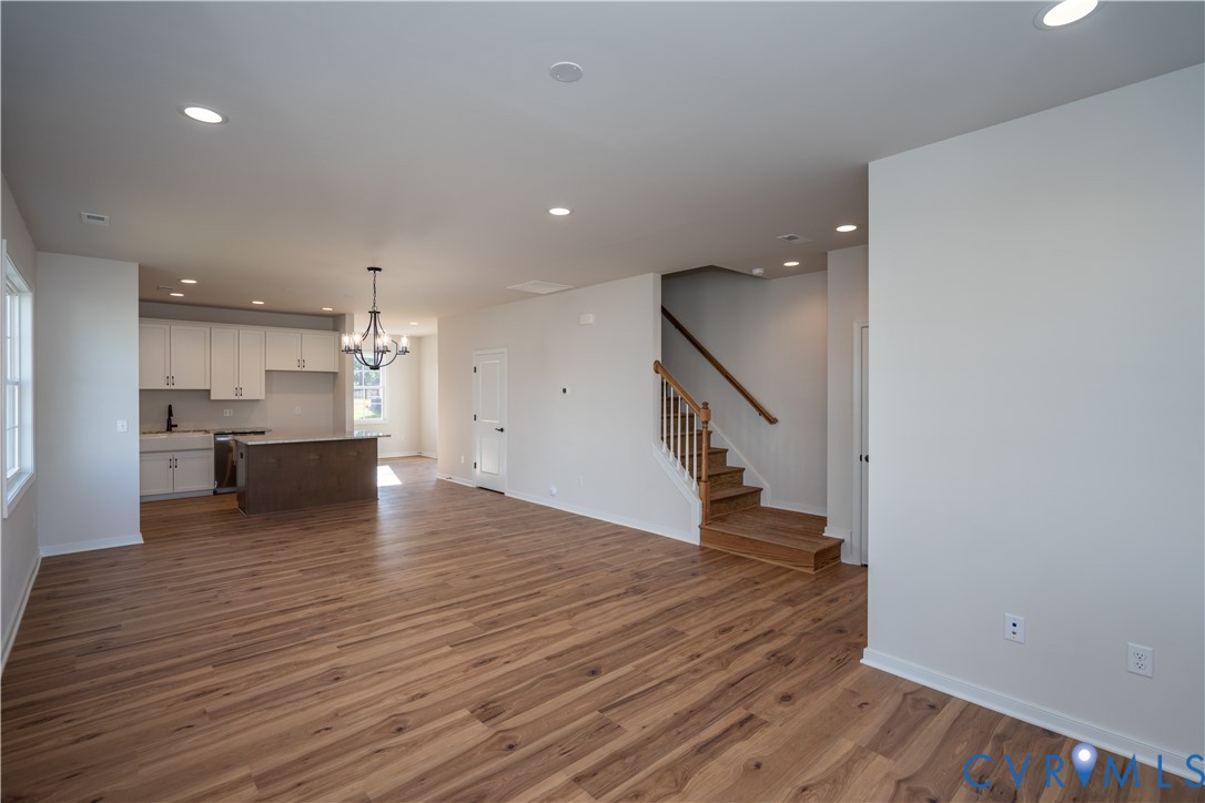 11219 Sparwood Road Chester, VA 23831 - Photo 3 of 28 a view of kitchen and hall with wooden floor