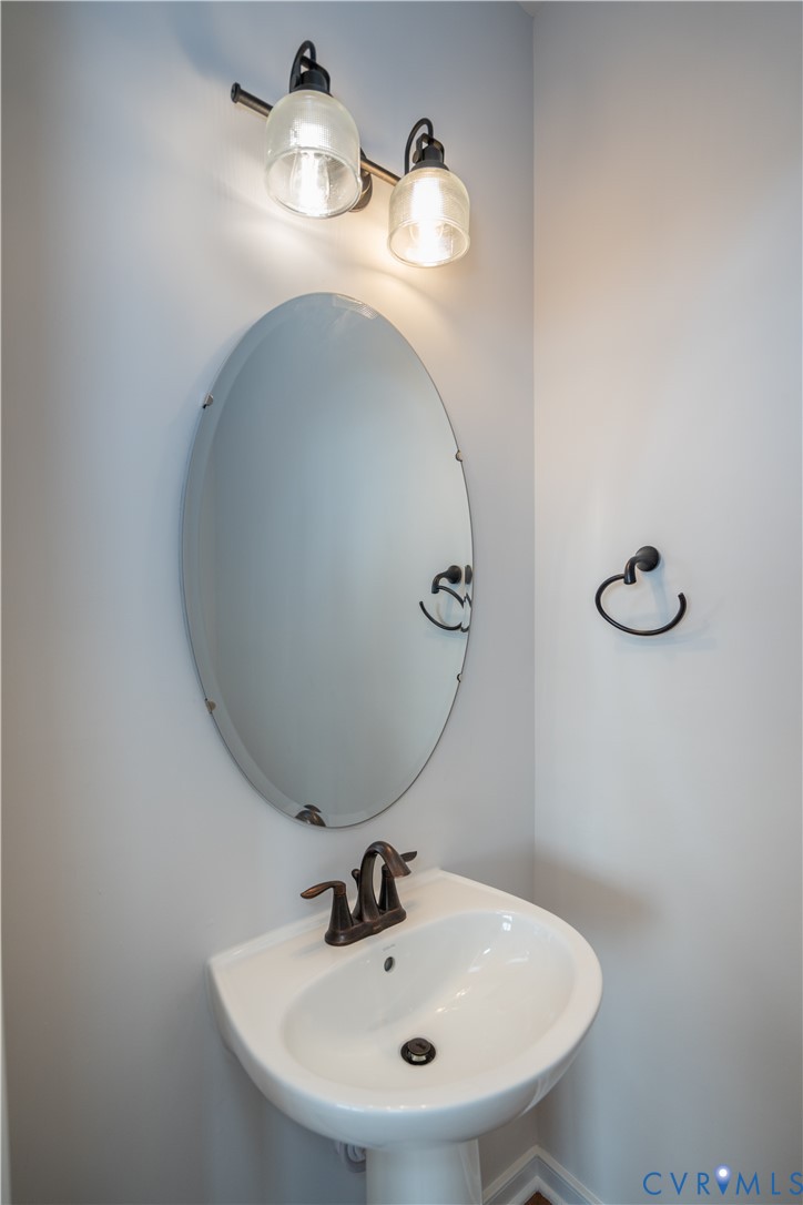 11219 Sparwood Road Chester, VA 23831 - Photo 9 of 28 a bathroom with a sink and mirror