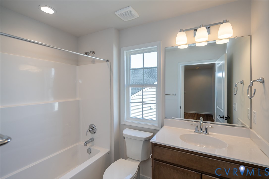 11219 Sparwood Road Chester, VA 23831 - Photo 10 of 28 a bathroom with a sink and a mirror
