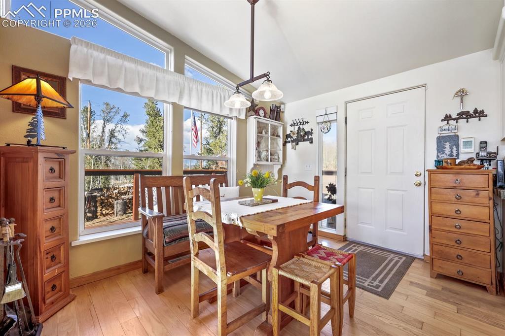 7260 Remington Road Como, CO 80432 - Photo 15 of 46 a view of a dining room with furniture window and wooden floor
