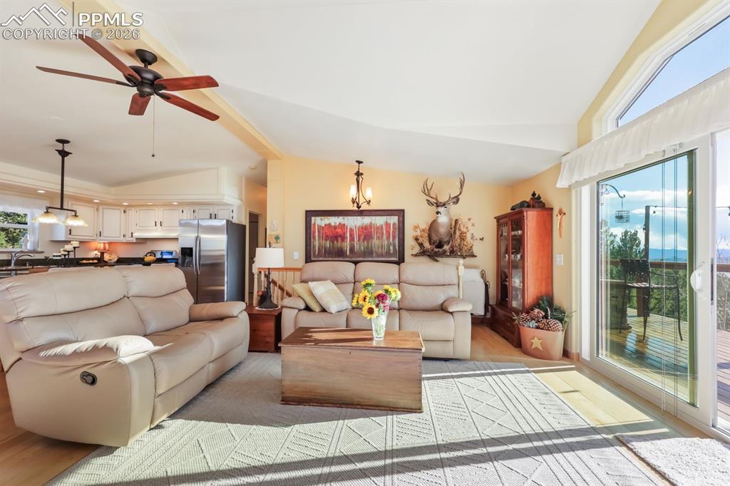 7260 Remington Road Como, CO 80432 - Photo 16 of 46 a living room with furniture and a chandelier
