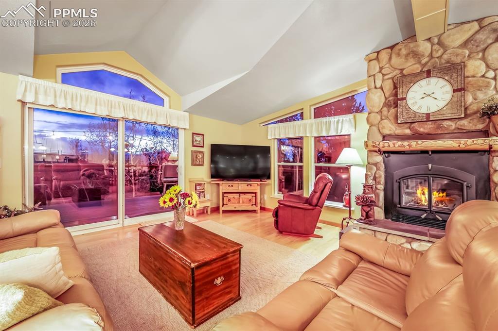 7260 Remington Road Como, CO 80432 - Photo 18 of 46 a living room with furniture a flat screen tv and a fireplace