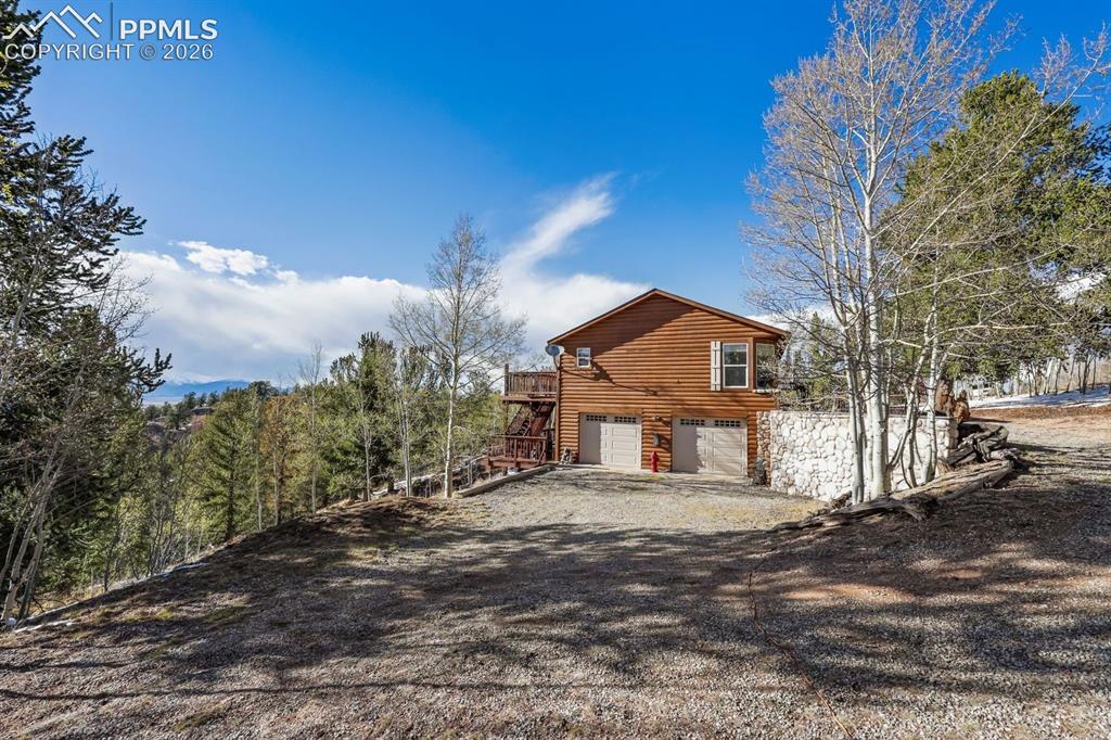 7260 Remington Road Como, CO 80432 - Photo 2 of 46 a front view of a house with a yard