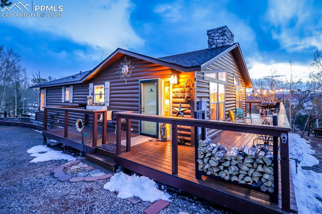 7260 Remington Road Como, CO 80432 - Photo 8 of 46 a view of a house with wooden deck and furniture