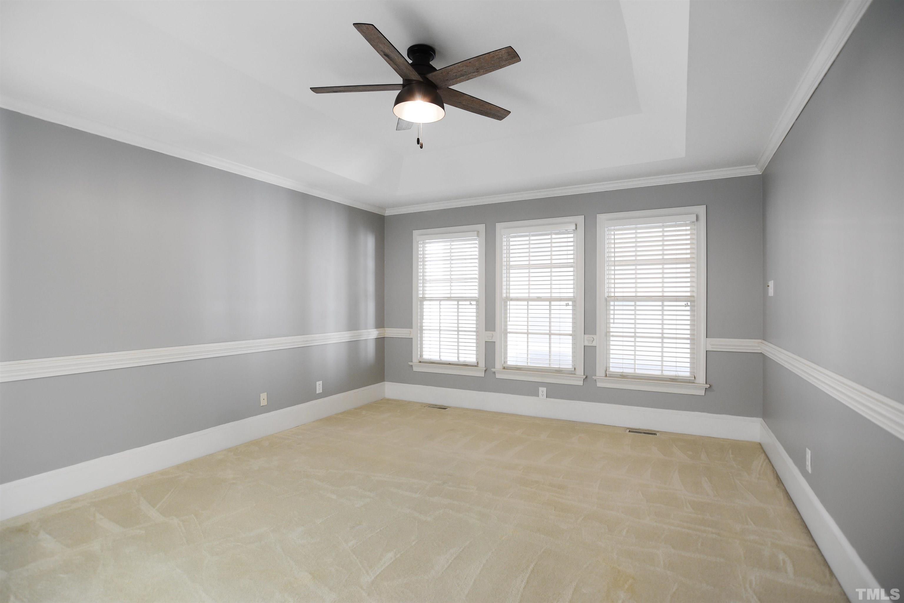 900 Tanworth Drive Raleigh, NC 27615 - Photo 11 of 26 wooden floor in an empty room with a window